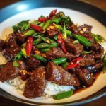 Fiery Thai beef stir-fry with chilies, garlic, and basil served with jasmine rice